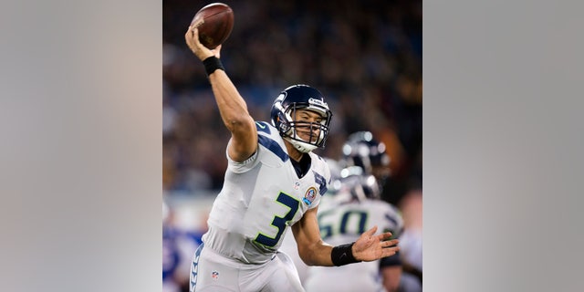 Seattle Seahawks quarterback Russell Wilson throws a pass against the Buffalo Bills during the first half of an NFL football game, Sunday, Dec. 16, 2012, in Toronto. (AP Photo/The Canadian Press, Frank Gunn)