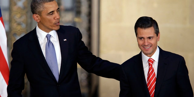 President Barack Obama and Mexico's President Enrique Pena Nieto, right, leave a joint news conference in Mexico City, Mexico, Thursday, May 2, 2013. Obama sought on Thursday to tamp down a potential rift with Mexico over a dramatic shift in the cross-border fight against drug trafficking and organized crime, acceding that Mexicans had the right to determine how best to tackle the violence that has plagued their country. (AP Photo/Dario Lopez-Mills)