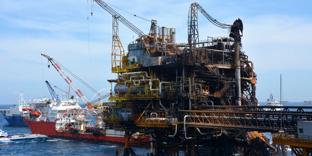 Emergency boats work to put out a fire at the Abkatun-A Permanente shallow-water oil platform in the Campeche Sound.