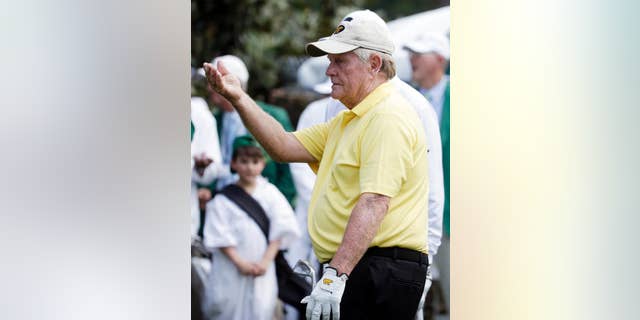 Jack Nicklaus watches his tee shot during the Par 3 contest at the Masters golf tournament Wednesday, April 8, 2015, in Augusta, Ga. (AP Photo/Darron Cummings)