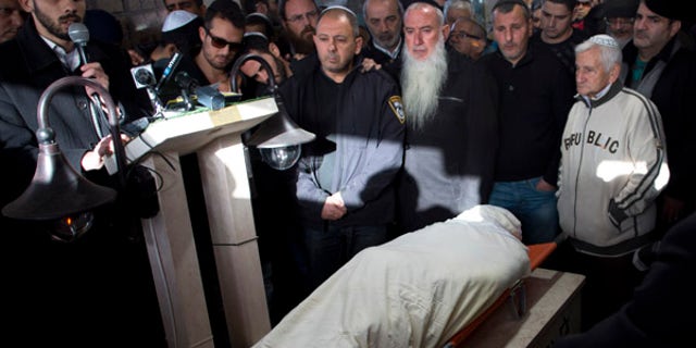 Jan. 3, 2016: Relatives and friends of Shimon Ruimi mourn during his funeral in the southern Israeli town of Ofakim. Ruimi, 30, was killed when a gunman opened fire outside a bar on a main street in Tel Aviv on Friday afternoon.