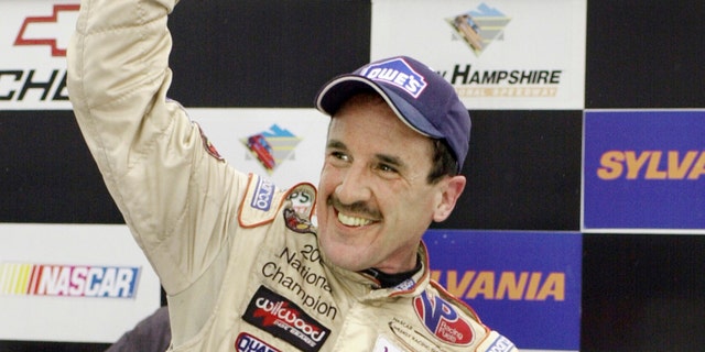 In this Sept. 16, 2005 file photo, Ted Christopher celebrates his victory in the Busch North Series Sylvania 125 at the New Hampshire International Speedway in Loudon, N.H.