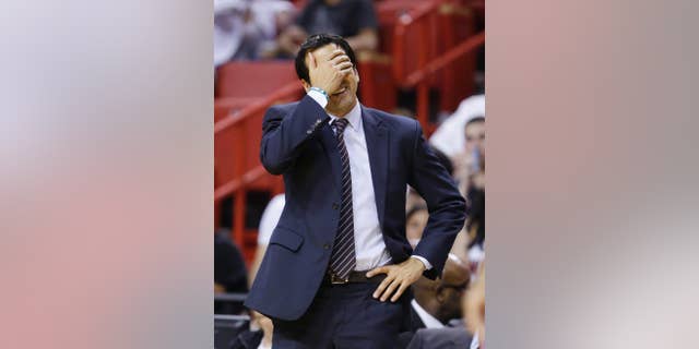 Miami Heat head coach Erik Spoelstra reacts after a call during the second half of an NBA basketball game against the Philadelphia 76ers, Wednesday, April 16, 2014 in Miami. The 76ers defeated the Heat 100-87. (AP Photo/Wilfredo Lee)