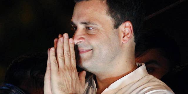 FILE - In this May 28, 2016, file photo, India's opposition Congress party vice-president Rahul Gandhi, greets his supporters during a protest rally against the Aam Aadmi Party or Common Man's Party led Delhi government and India's ruling Bharatiya Janata Party government over power cuts and water shortage in New Delhi, India. India's top court on Tuesday, July 19, 2016, has ordered a scion of India's Nehru-Gandhi family to express regret or face defamation charges for blaming the country's top Hindu nationalist organization for the 1948 assassination of independence leader Mohandas Gandhi. (AP Photo/Altaf Qadri, File)