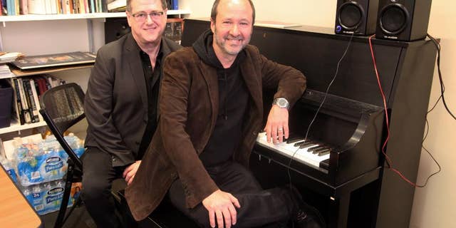 This April 30, 2015 photo shows playwright Robert L. Freedman, left, and composer Steven Lutvak in New York. The duo co-wrote the Tony Award-winning musical "A Gentleman's Guide to Love and Murder” and are being honored by their alma mater, New York University's Tisch School of the Arts. (AP Photo/Mark Kennedy)