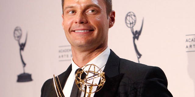 Aug. 2010: Seacrest holds his Emmy award for Outstanding Reality Program for "Jamie Oliver's Food Revolution" in Los Angeles. (Reuters)