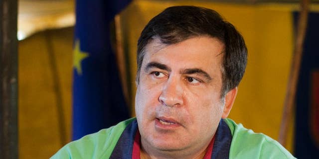 In this photo taken Monday, June 13, 2016, Governor of the Odessa region, Mikhail Saakashvili speaks to the Associated Press in Odessa, Ukraine. ﻿Saakashvili, the former president of Georgia, has brought his corruption-fighting record to his job as governor of the Odessa region in Ukraine. So far, however, the pace has been dismally slow. His stifled efforts in Odessa show the systemic problems still facing the entire country two years after it broke with Moscow and aligned itself firmly with the West. (AP Photo/Sergei Poliakov)