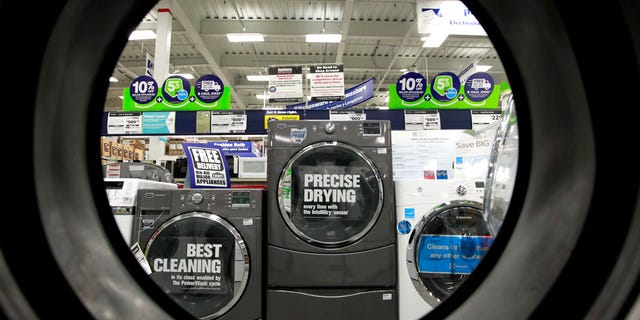 FILE - In this Monday, Sept. 10, 2012 file photo, dryers are seen from the inside of another clothes' dryer, foreground, at a Lowe's store location, in Framingham, Mass. Lowe's Cos. Inc. reports quarterly financial results before the market opens on Wednesday, May 22, 2013. (AP Photo/Steven Senne, File)