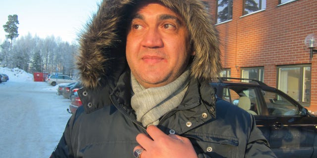 In this photo taken Jan. 23, 2013, Syrian asylum-seeker Wissam Attiki waits for a bus outside an immigration office in Marsta, Sweden. Along with Germany, which is nine times larger, Sweden stands out in Europe for its generous welcome to refugees fleeing a conflict that has killed tens of thousands and uprooted many more. European Union statistics show those two countries have received about two-thirds of the Syrians seeking shelter in the 27-nation bloc. (AP Photo/Karl Ritter)
