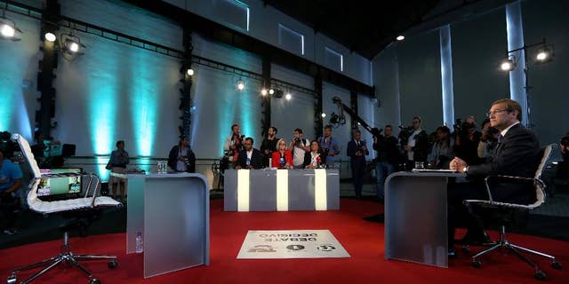 Portuguese Prime Minister Pedro Passos Coelho waits for the arrival of opposition Socialist Party leader Antonio Costa before their second debate in Lisbon, Thursday Sept. 17, 2015. Portugal will got to the polls to elect a new government on Oct. 4. (AP Photo/Steven Governo)
