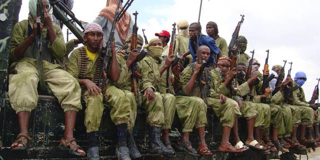 A group of al-Shabab fighters sit on a truck as they patrol in Mogadishu, Somalia