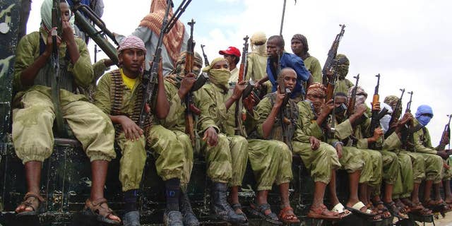 A group of al-Shabab fighters sit on a truck as they patrol in Mogadishu, Somalia