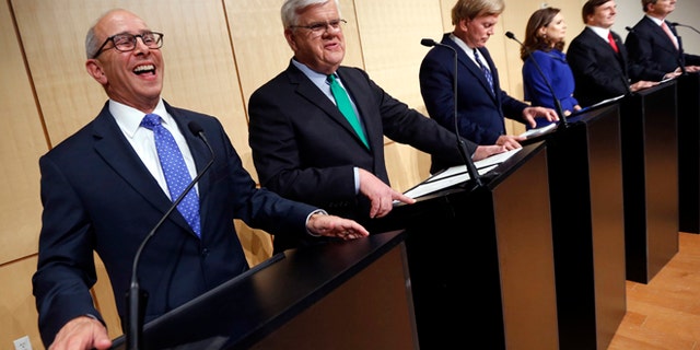 FILE - In this Nov. 2, 2016 file photo, Senate candidates, left to right, Rep. Charles Boustany, D-La., Louisiana Public Service Commissioner Foster Campbell, David Duke, attorney Carolyn Fayard, Rep. John Fleming, R-La., and Louisiana Treasurer John Neely Kennedy take their places before a debate at Dillard University in New Orleans.
