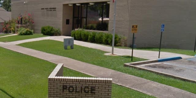 Four members of the Jasper Police Department were suspended after they made a hand gesture in a post-arrest photo that some say is a hate symbol that means “white power.”