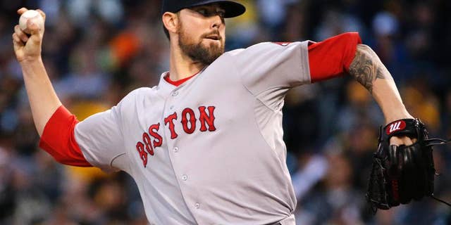 Boston Red Sox starting pitcher Anthony Ranaudo delivers during the first inning of a baseball game against the Pittsburgh Pirates in Pittsburgh Tuesday, Sept. 16, 2014. (AP Photo/Gene J. Puskar)
