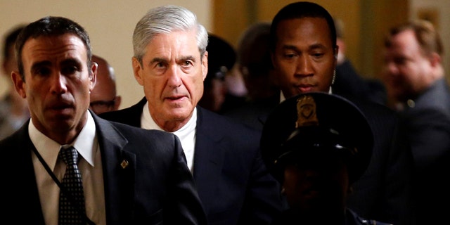 Special Counsel Robert Mueller with security guards in June 2017.