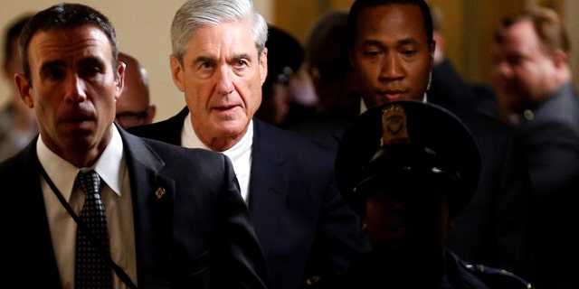 Special Counsel Robert Mueller with security guards in June 2017.