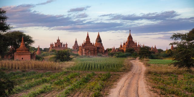 This December 2012 photo shows agricultire and some of the over 2200 Pagodas found in Bagan, Myanmar. (AP Photo/Richard Camp)