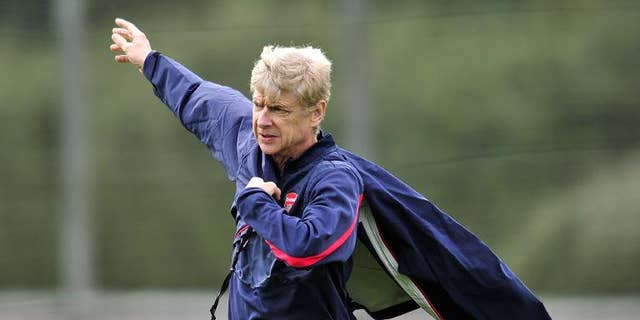 Arsenal's French manager Arsene Wenger is pictured during a team training session at Arsenal's London Colney training ground in north London on September 30, 2013