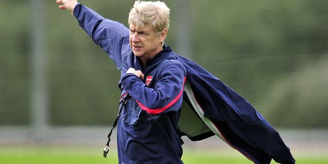 Arsenal's French manager Arsene Wenger is pictured during a team training session at Arsenal's London Colney training ground in north London on September 30, 2013