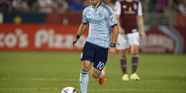 This Aug. 29, 2015 photo shows Sporting KC midfielder Benny Feilhaber (10) in the second half of an MLS soccer match in Commerce City, Colo. Feilhaber is one of several veteran players who thought their U.S. national team careers were over until they got a second shot under new coach Bruce Arena. After a January training camp, the revamped roster begins ramping up for key World Cup qualifiers with an exhibition against Serbia on Sunday in San Diego. (AP Photo/David Zalubowski)