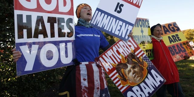 Nov. 11, 2010: Members of the Westboro Baptist Church hold anti-gay signs at Arlington National Cemetery in Virginia on Veterans Day.