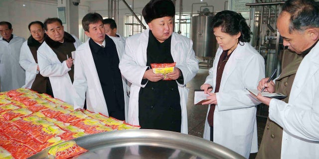 Kim Jong Un gives field guidance to the Pyongyang Children's Foodstuff Factory.