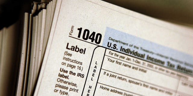 DES PLAINES, IL - MARCH 23: The top of a form 1040 individual income tax return for 2005 is seen atop a stack on the same at the Des Plaines Public Library March 23, 2006 in Des Plaines, Illinois. Americans are preparing for the income tax filing deadline next month whether using tax software, filing on the paper forms or using a tax preparer. (Photo by Tim Boyle/Getty Images)