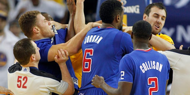 FILE - In this Dec. 25, 2013, file photo, Los Angeles Clippers power forward Blake Griffin, left, fights with Golden State Warriors center Andrew Bogut, right, as Clippers center DeAndre Jordan (6) and Darren Collison (2) look on during the second half of an NBA basketball game in Oakland, Calif. Griffin was ejected from the game. Whether the Warriors and Clippers are growing into unlikely California rivals might still be up for debate. This much is clear: neither team likes the other. The Pacific Division-leading Clippers visit the Warriors on Thursday night for the first time since Golden State's win on Christmas was marred by multiple technical fouls, elbows and heated verbal exchanges. (AP Photo/Tony Avelar, File)