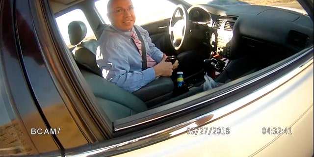 This image made from a law enforcement body camera video shows Arizona state Rep. Paul Mosley during a traffic stop outside Parker, Ariz., March 27, 2018.