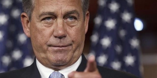 FILE: House Speaker John Boehner takes questions during a news conference on Capitol Hill, in Washington, D.C.