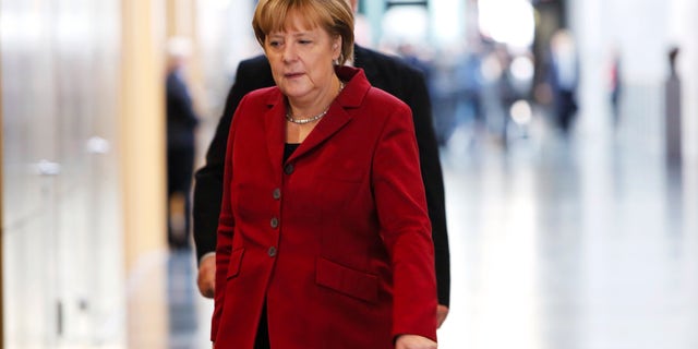 German Chancellor and chairwoman of the Christian Democrats, CDU, Angela Merkel arrives for a meeting with the Christian parties delegation prior to exploratory talks on a coalition with the Social Democratic Party, SPD, in Berlin, Germany, Thursday, Oct. 17, 2013. Following the national elections on Sept. 22, 2013, Merkel is still in negotiations for a coalition partner for her third term. (AP Photo/Markus Schreiber)