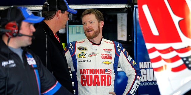 Dale Earnhardt Jr., talks with his team during testing at Texas Motor Speedway, Thursday, April 11, 2013, in Fort Worth,Texas. The NASCAR Sprint Cup Series NRA 500 auto race is scheduled to run Saturday, April 13. (AP Photo/The Fort Worth Star-Telegram, Ron Jenkins)  MAGS OUT; (FORT WORTH WEEKLY, 360 WEST); INTERNET OUT