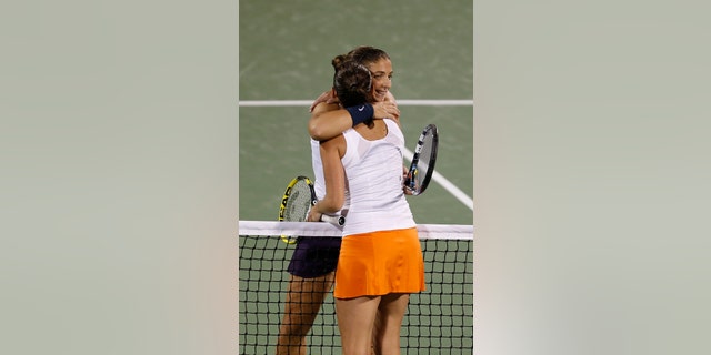 Sara Errani of Italy is congratulated by Roberta Vinci of Italy after winning the semifinals of the Dubai Duty Free Tennis Championships in Dubai, United Arab Emirates, Friday, Feb. 22, 2013. (AP Photo/Regi Varghese)