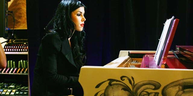 Sept. 8, 2011: Tattoo artist and TV star Kat Von D entertains the guests by playing the piano during Sephora Times Square & Sephora 5 Times Square Fashion's Night Out at Sephora Times Square in New York City.