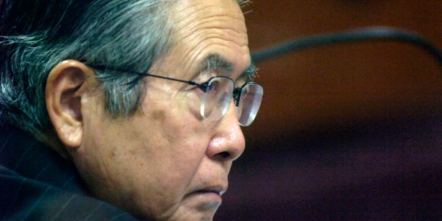 FILE - In this Jan. 23, 2008 file photo, Peru's former President Alberto Fujimori attends a session of his trial at a police base in Lima, Peru. Incarcerated for authorizing death squads and corruption, the former leader is not permitted to give interviews or make public statements. Yet he has 10,000 Twitter followers three weeks after opening an account, and he’s used YouTube three times to make short audio statements, setting off a media sensation in Peru as he rallies supporters and trades barbs with political foes. (AP Photo/Karel Navarro, File)