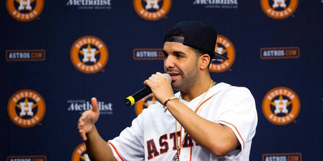 Grammy Award-winning artist Drake speaks at a press conference before a baseball game against the Arizona Diamondbacks and the Houston Astros, Thursday, June 12, 2014, in Houston. (AP Photo/Patric Schneider)