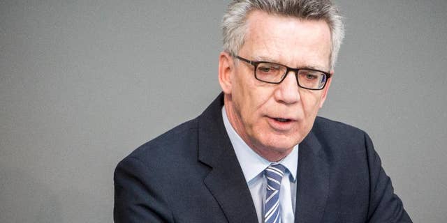 German Interior Minister Thomas de Maiziere delivers speech during a session of the German parliament Bundestag in Berlin, Friday, May 13, 2016 when the parliament declared Morocco, Tunisia and Algeria as a safe countries of origin. (Michael Kappeler/dpa via AP)