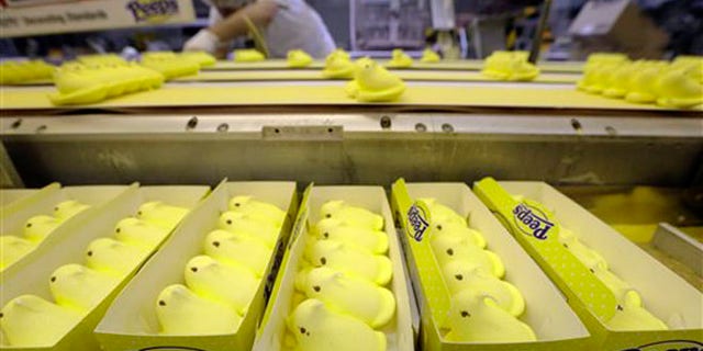 In this Wednesday, Feb. 13, 2013 photo Peeps move through the manufacturing process, at the Just Born factory in Bethlehem, Pa. With the storied candy brand celebrating its 60th anniversary this year, a quirky new TV ad campaign talks about all the things people do with their Peeps. (AP Photo/Matt Rourke)