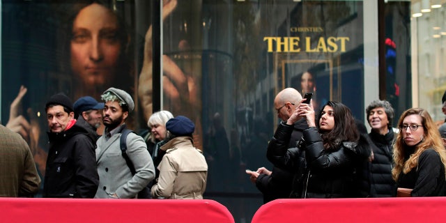 Visitors to Christie's wait outside in a line to view Leonardo da Vinci's "Salvator Mundi", Tuesday, Nov. 14, 2017, in New York.