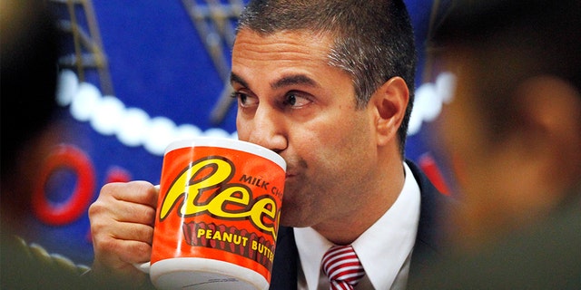 FCC Chairman Ajit Pai has been trolled for his oversized Reese's mug.