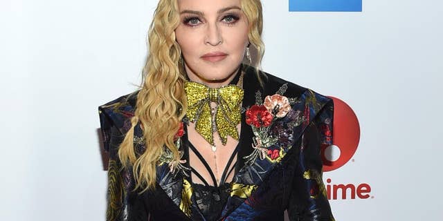 Madonna isn't too happy about a planned biopic titled "Blond Ambition." Here, she is shown in a Dec. 9, 2016 file photo.