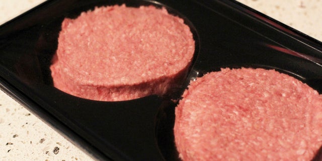 Photo made Jan 16 2013 of two beef burgers purchased in Ireland, following an outcry over the revelation that some burgers made in the republic and on sale in British supermarkets contained a large proportion of horse meat. The burgers were swiftly withdrawn from sale. A Spanish supermarket chain has withdrawn its own-brand hamburgers Wednesday Jan 30 2013 after a consumer protection group also found tiny traces of horsemeat in them. (AP Photo/Niall Carson/PA) UNITED KINGDOM OUT NO SALES NO ARCHIVE
