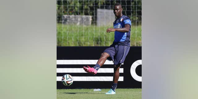 Italy's Mario Balotelli kicks the ball during a training session in Mangaratiba, Brazil, Tuesday, June 17, 2014. Italy plays in group D at the 2014 soccer World Cup. (AP Photo/Antonio Calanni)