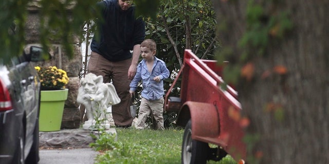 Joshua Boyle and his son Jonah played in the garden at his parents house in Ontario, on Saturday, Oct. 14, 2017.