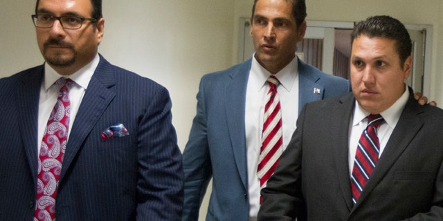 Aug. 27: David Barajas, right, walks through the hallway with his attorneys Sam Cammack, center, and Phil Morin as the jury deliberates at the Brazoria County Courthouse.