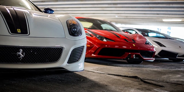 There is over a million dollars worth of cars in this photo alone.