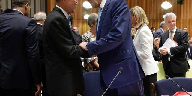 United Nations Secretary General Ban Ki-moon, left, greets U.S. Secretary of State John Kerry before the seventh Ministerial Meeting of the Comprehensive Nuclear-Test-Ban Treaty (CTBT) during the 69th session of the United Nations General Assembly at U.N. headquarters on Friday, Sept. 26, 2014. The meeting was co-organized by Australia, Canada, Finland, Germany, Japan and the Netherlands. (AP Photo/Pool, Jason Szenes)