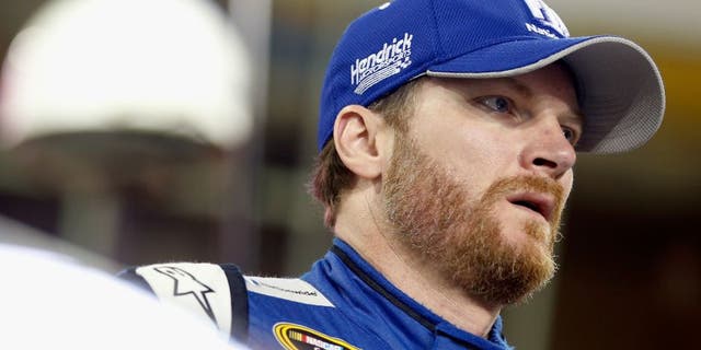 HOMESTEAD, FL - NOVEMBER 20: Dale Earnhardt Jr., driver of the #88 Nationwide Chevrolet, stands on the grid during qualifying for the NASCAR Sprint Cup Series Ford EcoBoost 400 at Homestead-Miami Speedway on November 20, 2015 in Homestead, Florida. (Photo by Brian Lawdermilk/Getty Images)