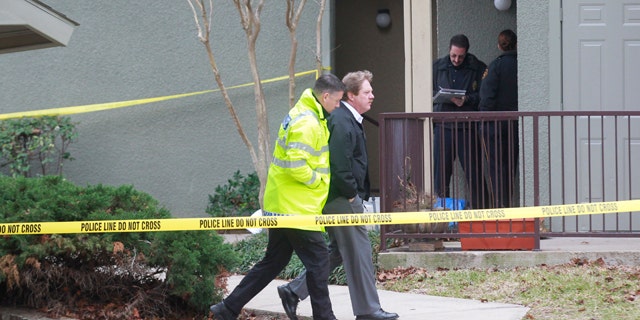Dec. 25, 2011: Grapevine police investigate the scene where they found seven people dead outside Dallas in Grapevine, Texas.